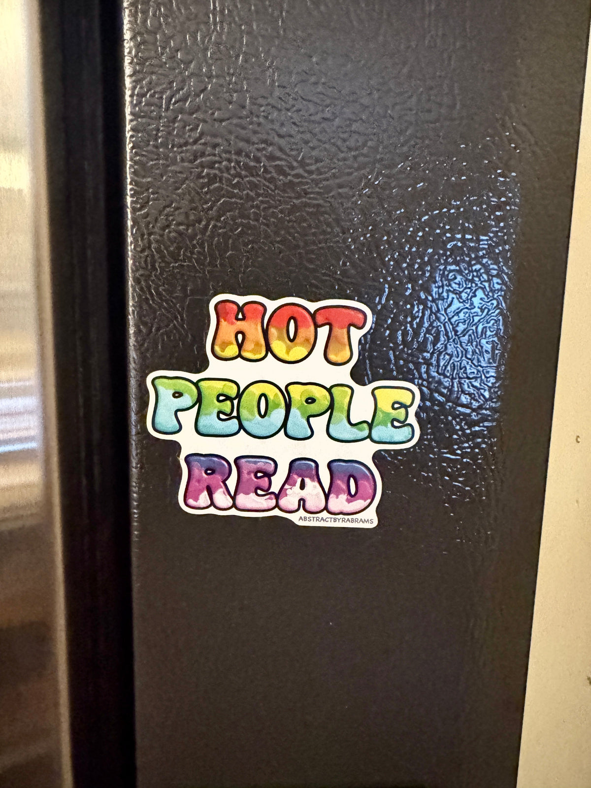 A colorful refrigerator magnet that reads &