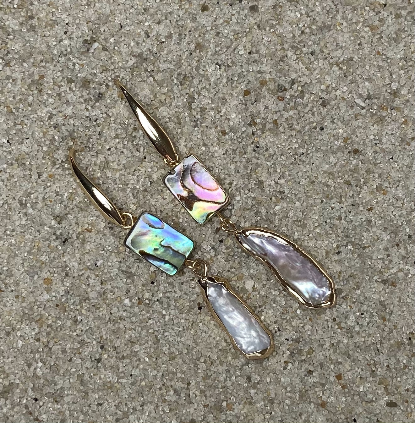 ocean springs rectangular abalone shell and organic freshwater pearl drop earrings on sand
