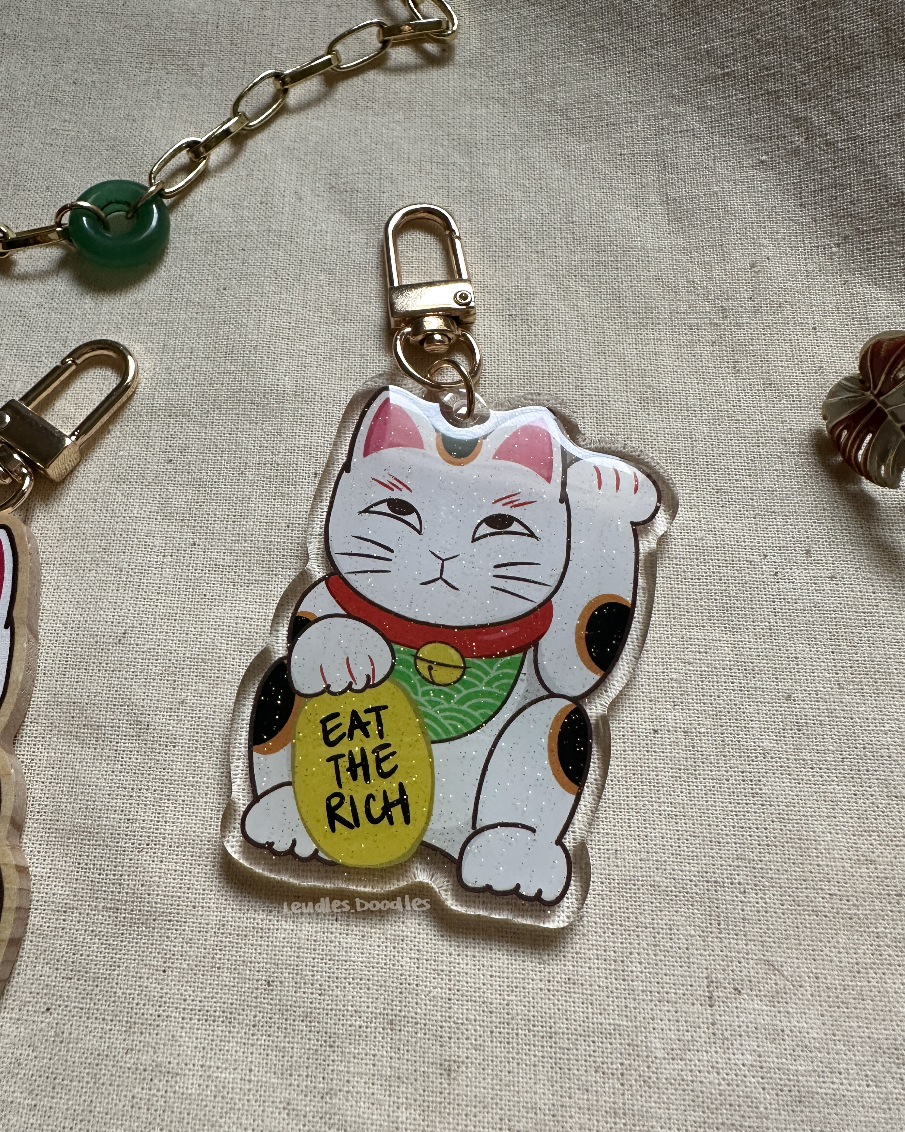 Eat The Rich Lucky Cat Wooden and Acrylic Keychains