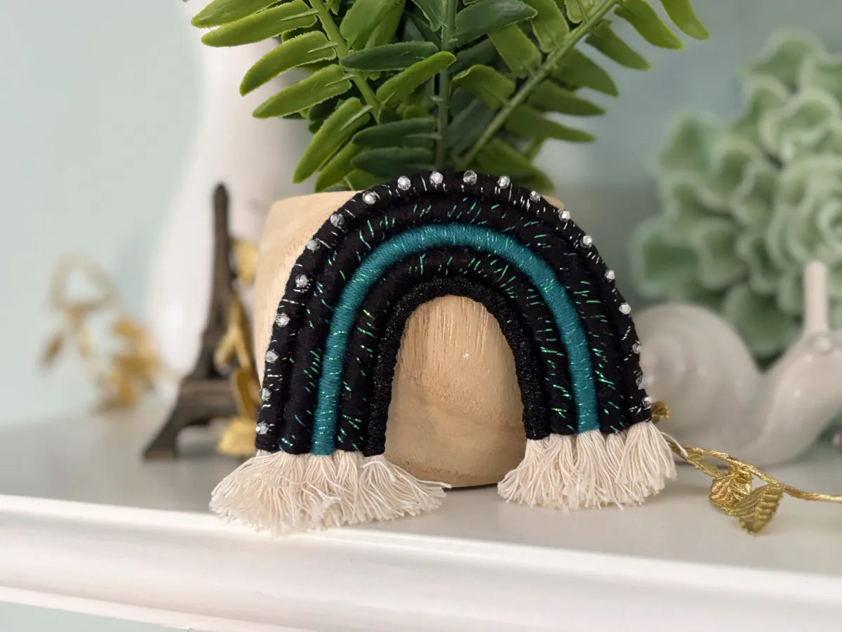 handmade black and teal fiber art rainbow