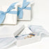 the beach and back gift wrap with signature wave and sea gull pattern  tissue paper with white paper wrap and turquoise ribbon bow