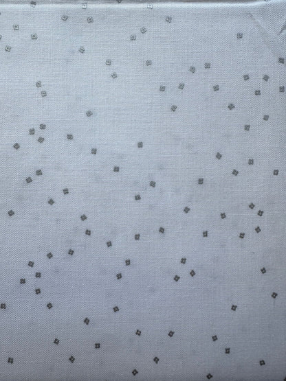 White fabric with small silver diamond patterns