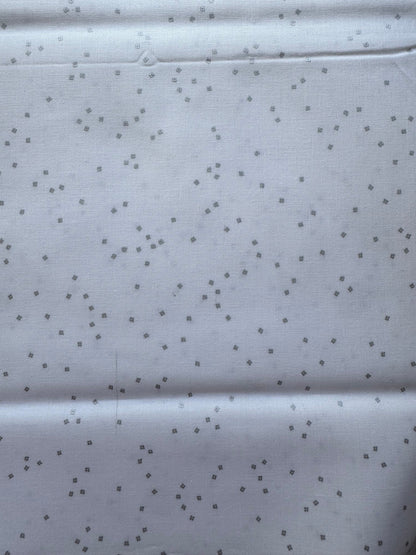 White fabric with small silver diamond patterns