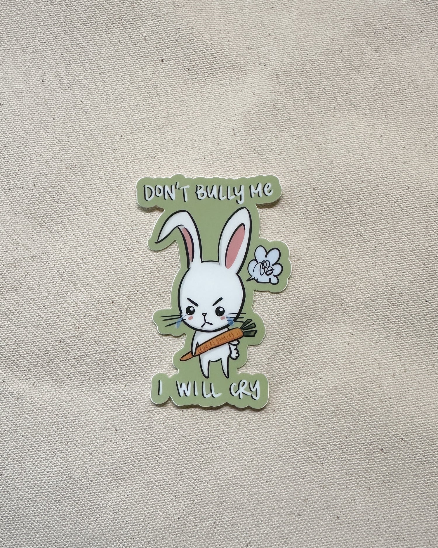 Sticker with a cartoon rabbit holding a carrot and text that says "Don&