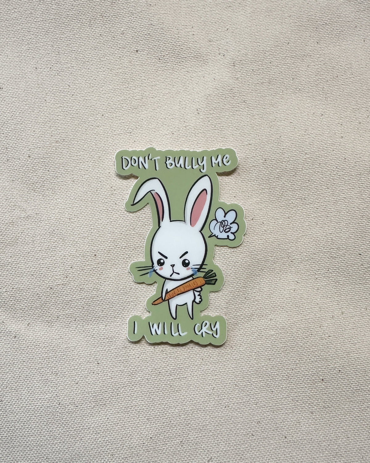 Sticker with a cartoon rabbit holding a carrot and text that says "Don&