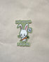 Sticker with a cartoon rabbit holding a carrot and text that says "Don&