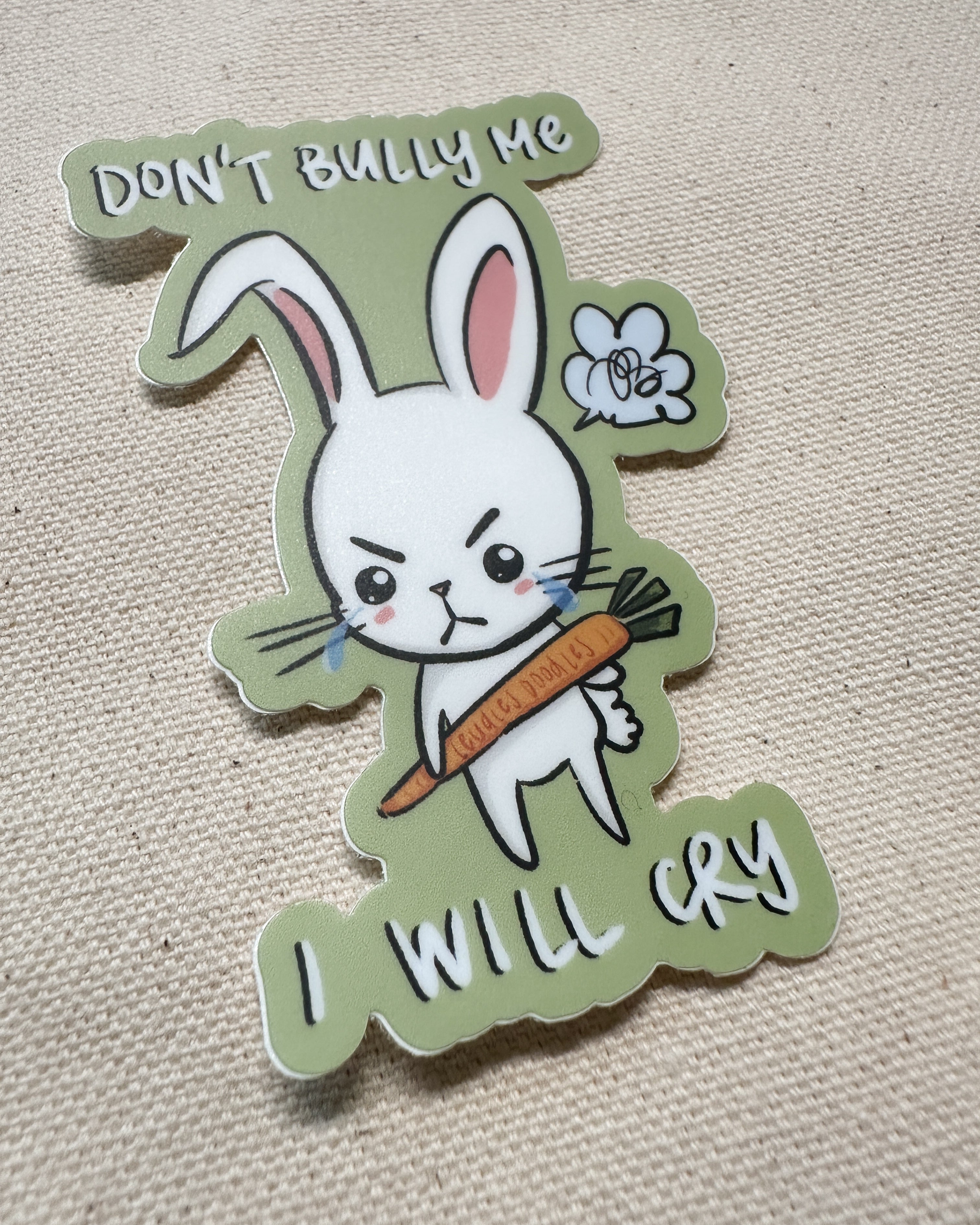 Sticker with a cartoon rabbit holding a carrot and text that says "Don&