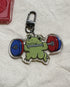 Keychain with a frog lifting weights