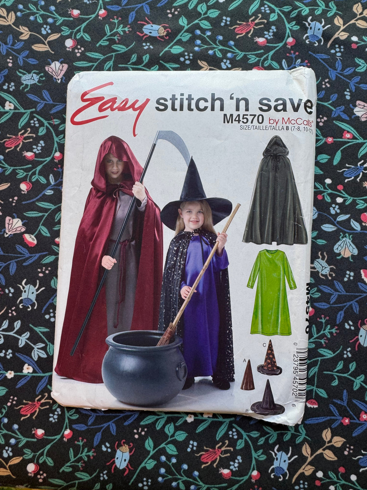 Pattern packaging for Halloween costumes on a decorative fabric background