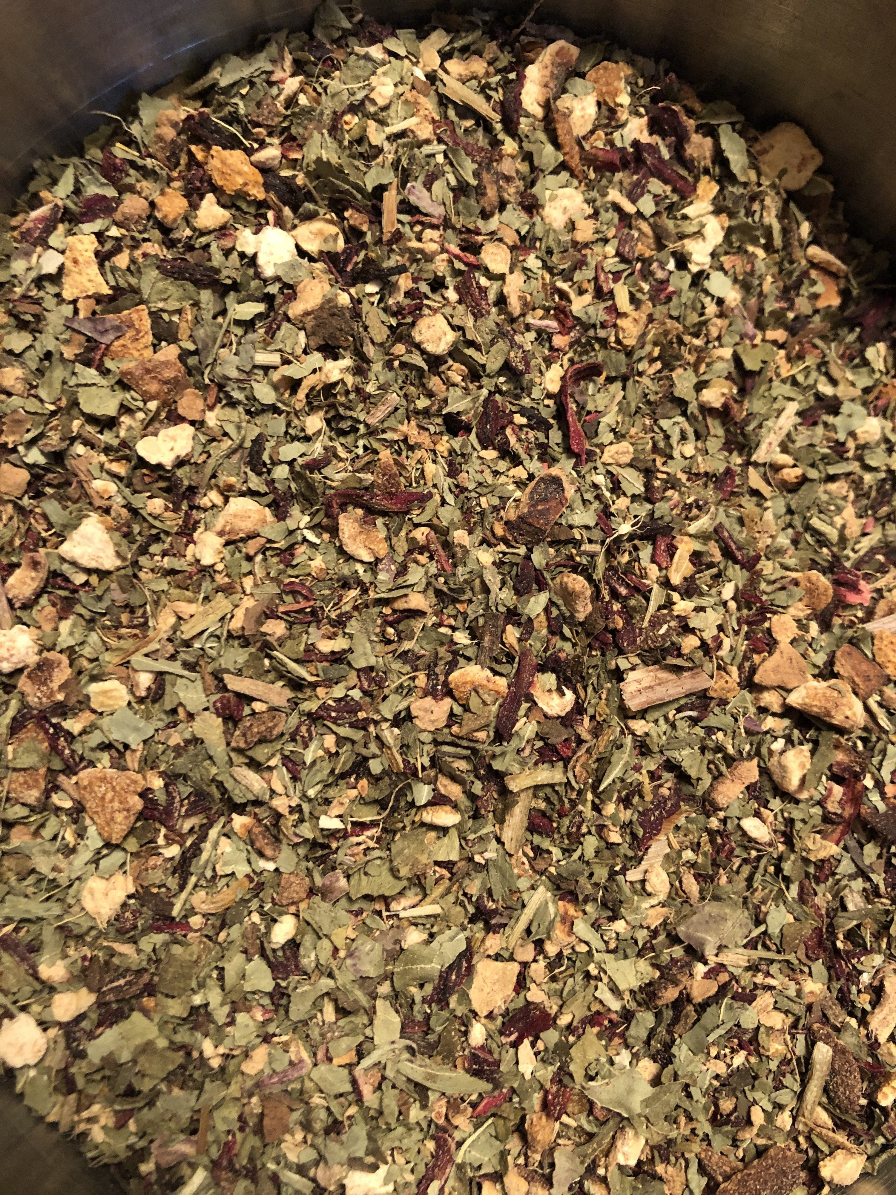 Hibiscus, dandelion leaf, orange peel, and ginger