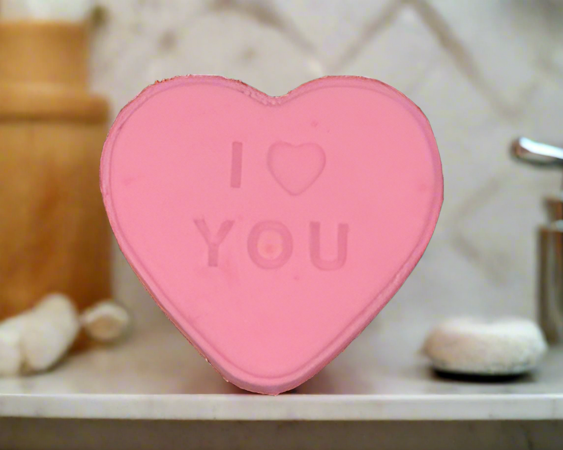 bath bomb with a I heart you text in pink