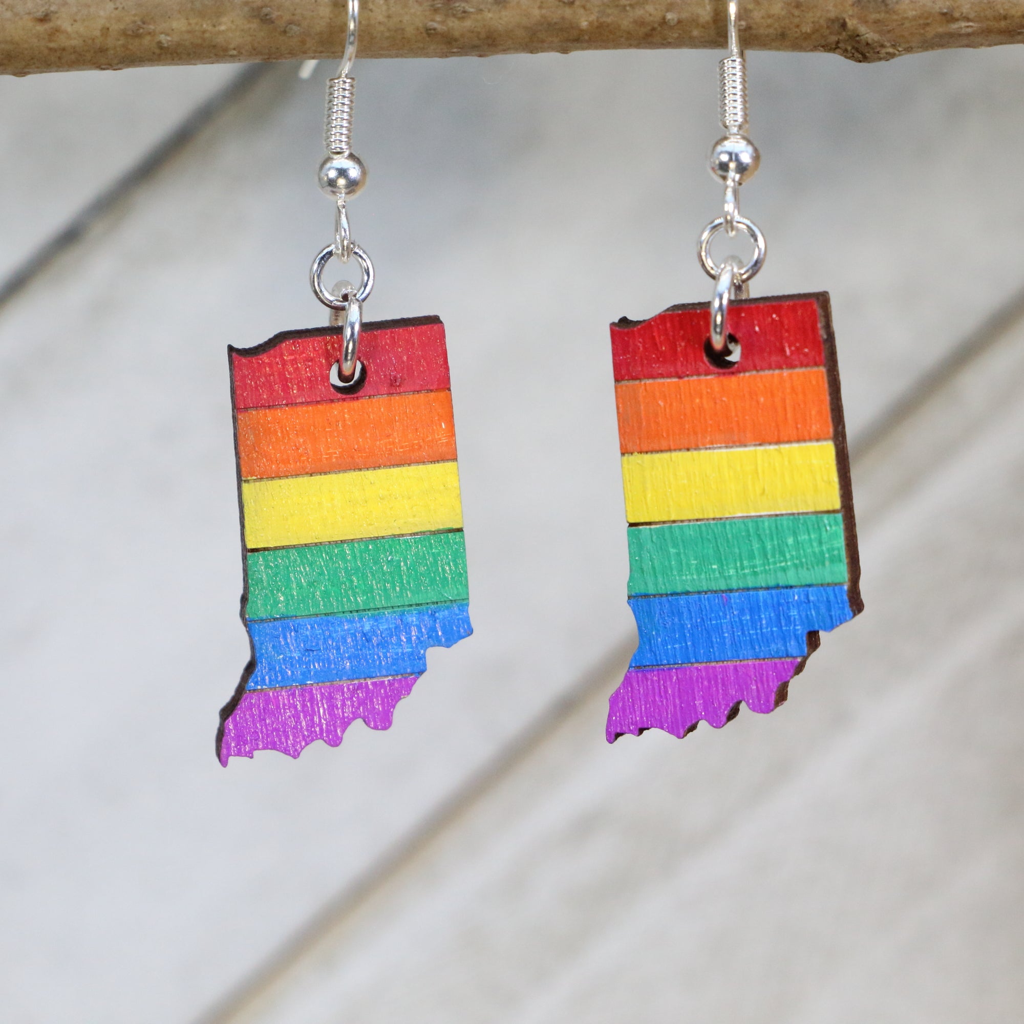 Hand-painted wooden Indiana pride flag dangle earrings with rainbow state-inspired design and hypoallergenic sterling silver hooks, lightweight LGBTQ jewelry for Indiana pride and inclusive style by Cate’s Concepts