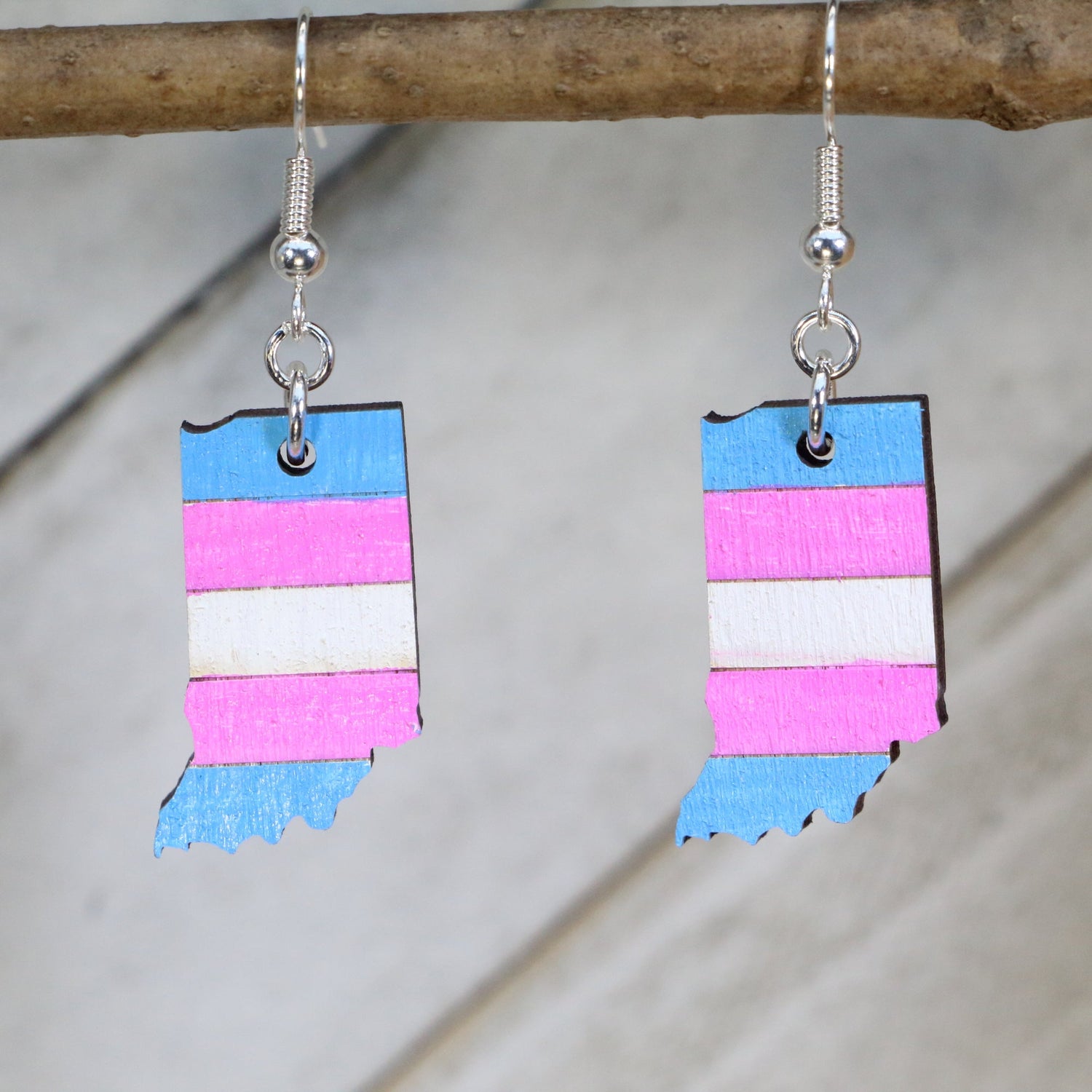 Hand-painted wooden Indiana transgender pride flag dangle earrings with state-inspired trans flag design and hypoallergenic sterling silver hooks, lightweight LGBTQ jewelry for Indiana pride and inclusive style by Cate’s Concepts