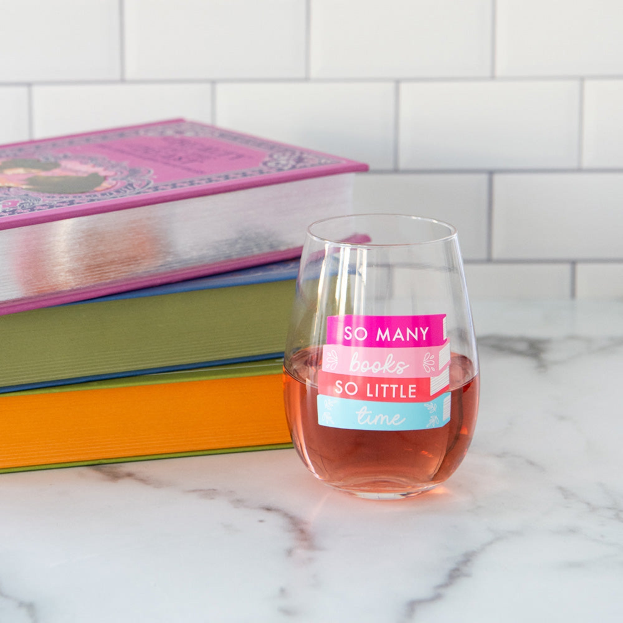 So Many Books wine glass styled with book club accessories and coordinating party supplies, Jollity &amp; Co.