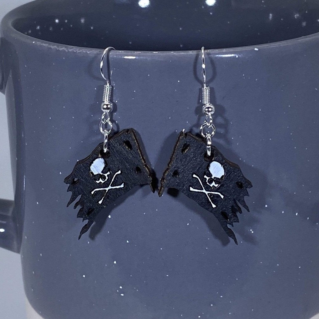 Hand-painted wooden Jolly Roger pirate dangle earrings with skull and crossbones design and hypoallergenic sterling silver hooks, lightweight pirate statement jewelry earrings for nautical and rebellious style
