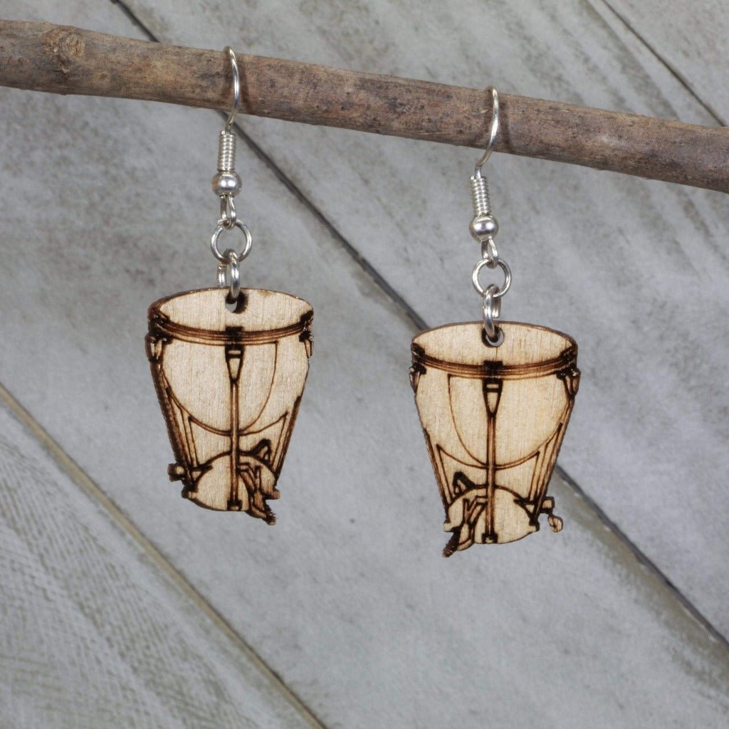 Hand-painted wooden kettle drum dangle earrings featuring a detailed timpani design with rounded drum body and stand accents and hypoallergenic sterling silver hooks, lightweight jewelry for percussionists and band enthusiasts by Cate’s Concepts