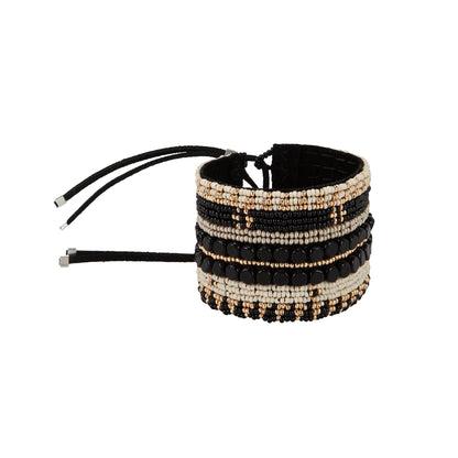 Black, gold and ivory handmade Maasai beadwork wide cuff bracelet by Sidai Designs, ethical jewelry brand, fair trade artisan jewelry Tanzania