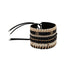 Black, gold and ivory handmade Maasai beadwork wide cuff bracelet by Sidai Designs, ethical jewelry brand, fair trade artisan jewelry Tanzania