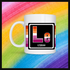 White mug with a 3 inch square containing the element’s symbol (Le) and name (Lesbian). Symbol is made with the colors of that element’s flag in a black square with the element’s flag behind the square. Behind the mug is a rainbow background.