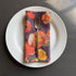 European Linen napkin with an Ember Poppies pattern on elderberry
