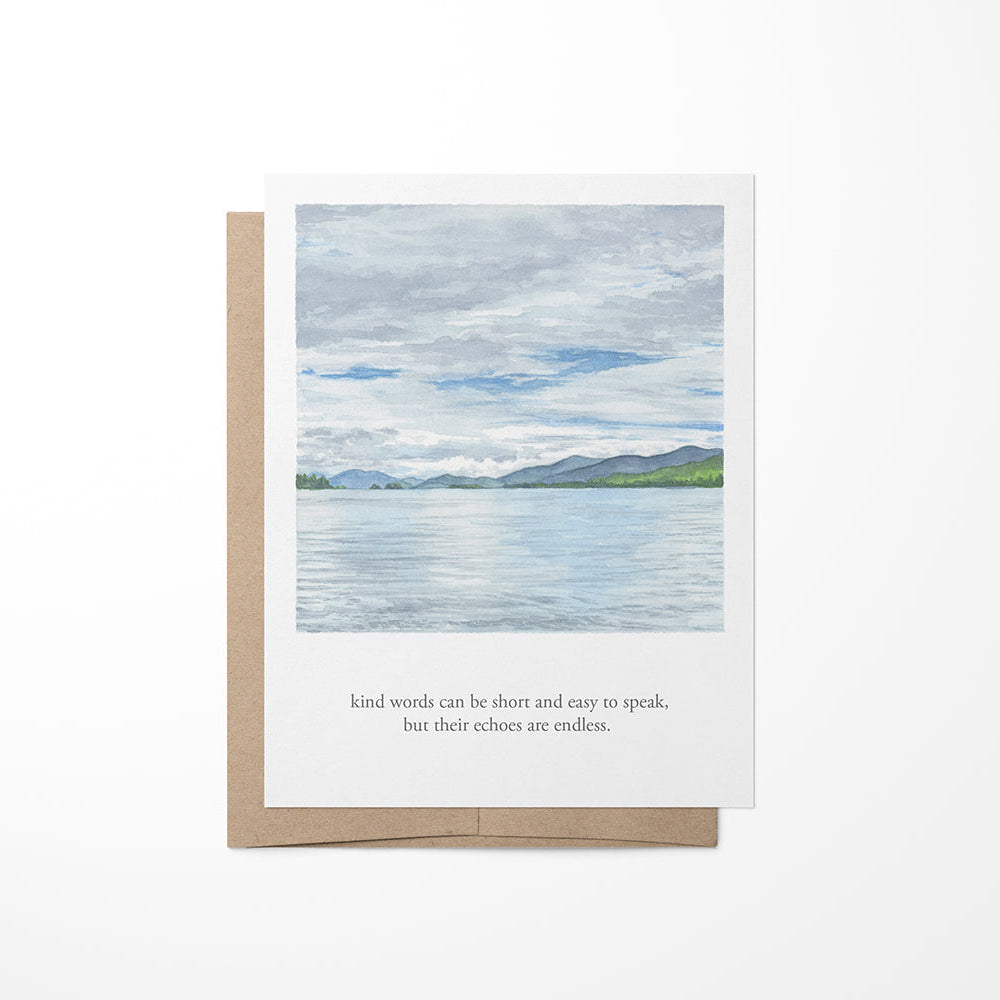 A greeting card featuring a watercolor landscape painting of Lake George with a quote from Mother Theresa