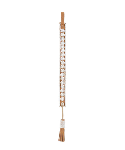 White handmade Maasai beadwork flower on leather bookmark by Sidai Designs, ethical artisan sustainable jewelry brand, Tanzania