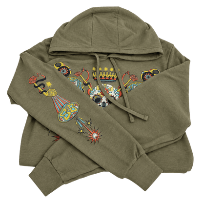 An olive green hoodie with a detailed multicolor graphic print featuring a hot air balloon, a crown, and decorative elements on the chest and sleeves, shown on a plain white background.