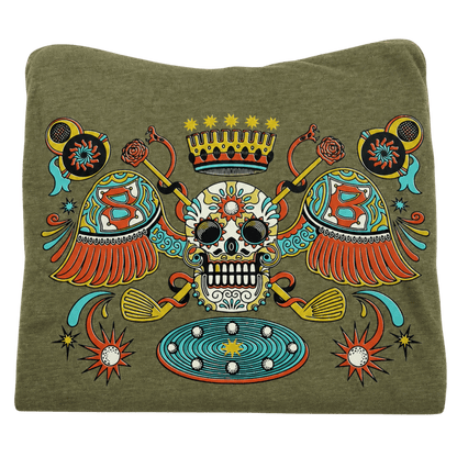 An olive green crewneck sweatshirt featuring a large, colorful Day of the Dead sugar skull graphic on the front, complete with a crown, crossed guitars, and decorative elements.