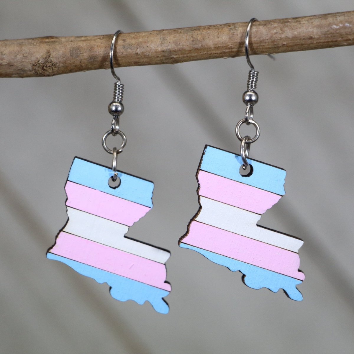 Hand-painted wooden Louisiana trans pride dangle earrings with transgender flag inspired state design and hypoallergenic sterling silver hooks, lightweight LGBTQ statement jewelry earrings for Louisiana pride and inclusive style