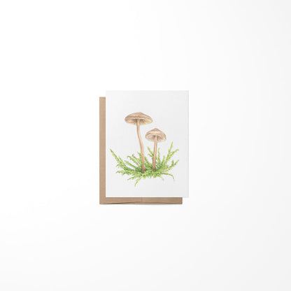 A greeting card featuring a miniature painting of mushrooms on a white background, with a Kraft envelope.