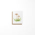 A greeting card featuring a miniature painting of mushrooms on a white background, with a Kraft envelope.
