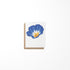 A greeting card featuring a morning glory flower painting on the front, with a Kraft envelope.