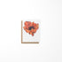 A greeting card featuring a colorful poppy flower painting by Heather S Vitticore, presented on a white background.