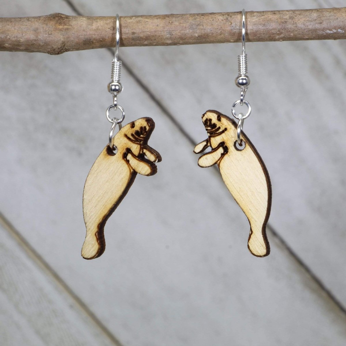 Hand-painted wooden manatee dangle earrings with realistic sea life design and hypoallergenic sterling silver hooks, lightweight manatee statement jewelry earrings for ocean lovers and marine animal fans