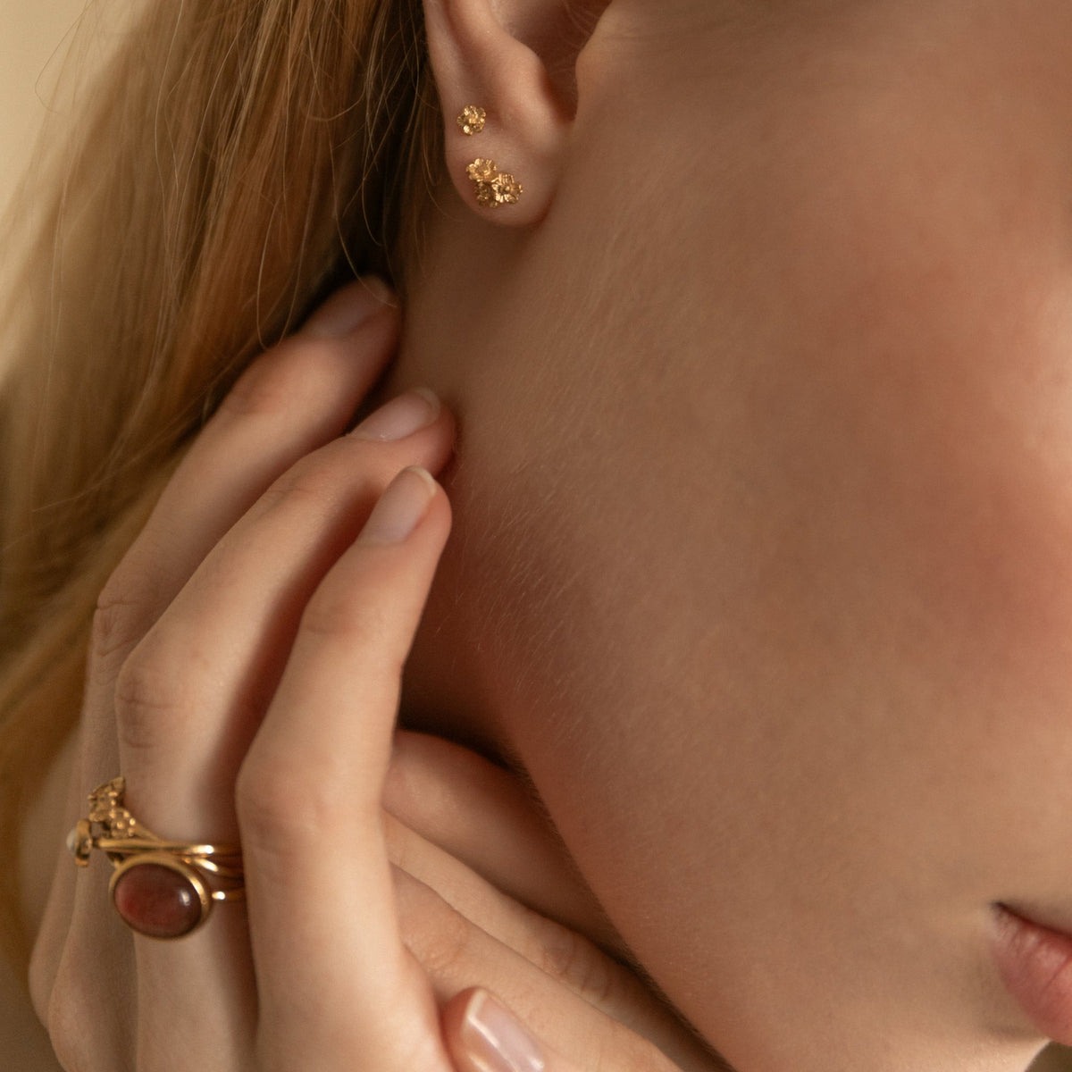 Artisan made gold ring and earrings gift, on model