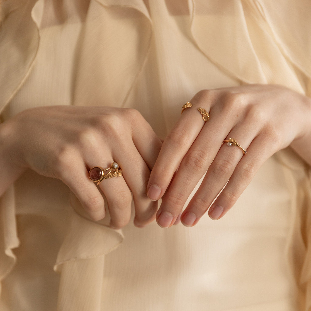 Artisan handmade gold rings on model
