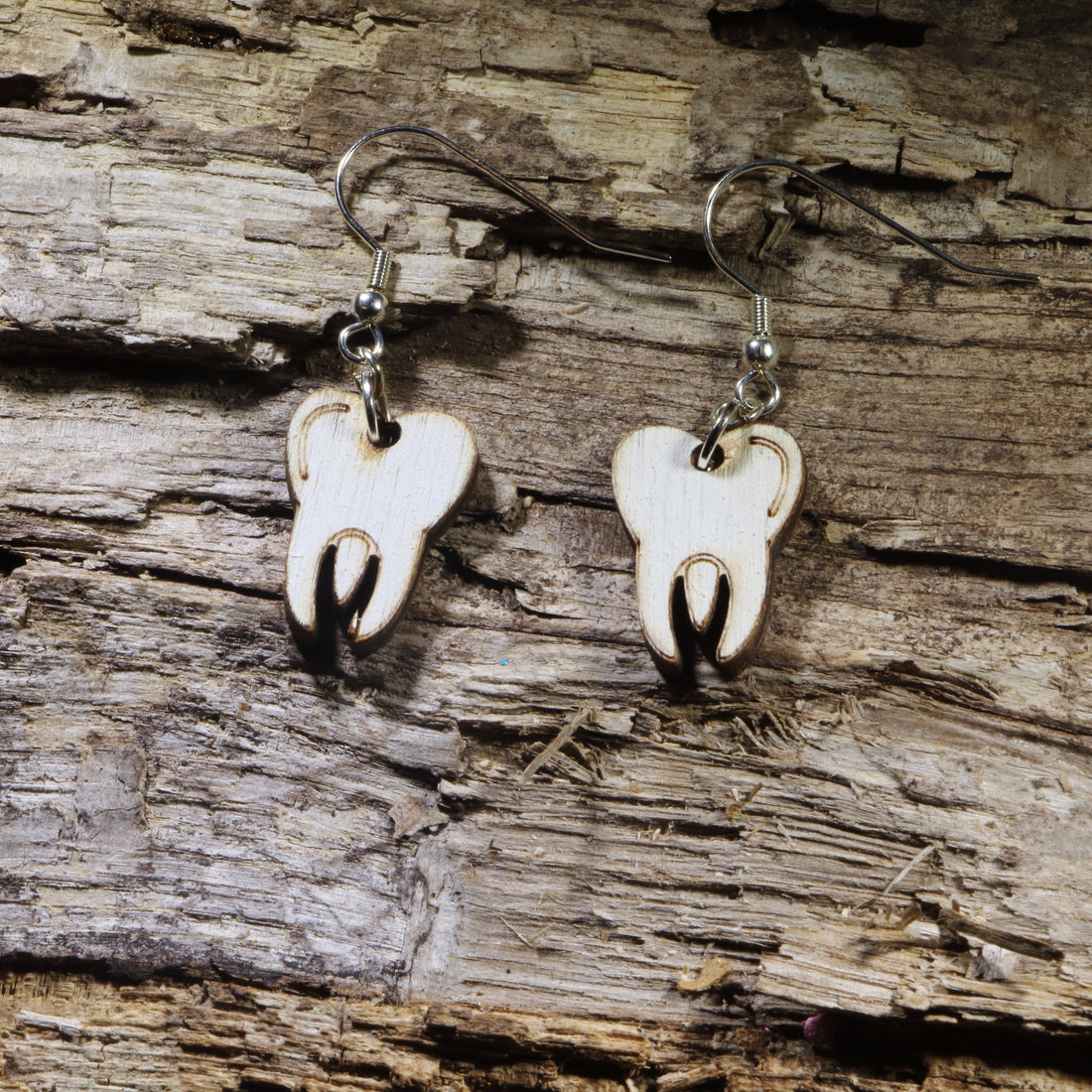 Hand-painted wooden molar tooth dangle earrings featuring a clean, classic tooth design. Lightweight dental-themed earrings with hypoallergenic .925 sterling silver hooks, perfect for dentists, dental hygienists, dental assistants, orthodontists, dental students, and anyone who loves fun healthcare-inspired jewelry.