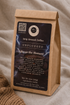 A kraft paper coffee bag labeled &