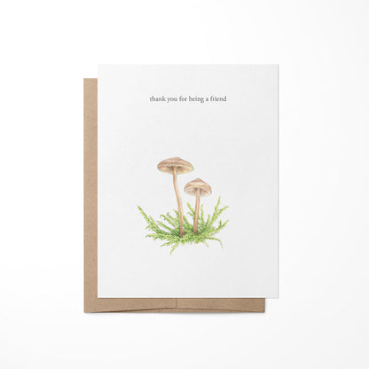 A greeting card with a mushroom illustration and the text &