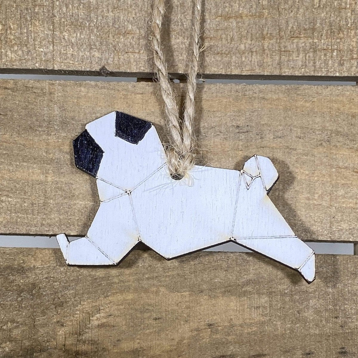 Hand-painted wooden origami pug Christmas ornament featuring a geometric folded-style dog design with cute facial details, festive holiday decor for dog lovers and pug enthusiasts by Cate’s Concepts