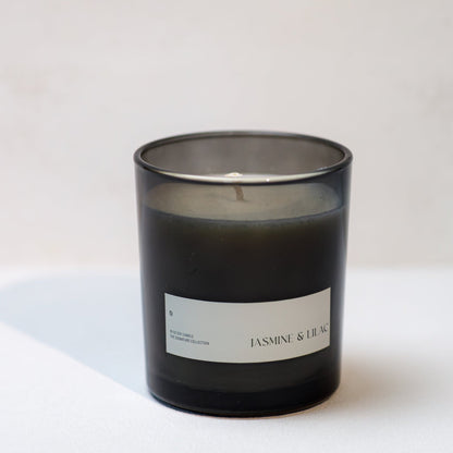Black candle with a label on a white background