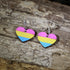 Hand-painted wooden pansexual heart dangle earrings featuring pink, yellow, and blue pansexual pride stripes, hypoallergenic sterling silver hooks, and lightweight LGBTQ+ pride jewelry for pansexual pride celebrations and queer accessory lovers by Cate&