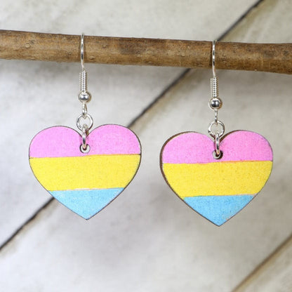 Hand-painted wooden pansexual heart dangle earrings with vibrant LGBTQ pride design and hypoallergenic sterling silver hooks, colorful equality statement jewelry for pride events and everyday expression