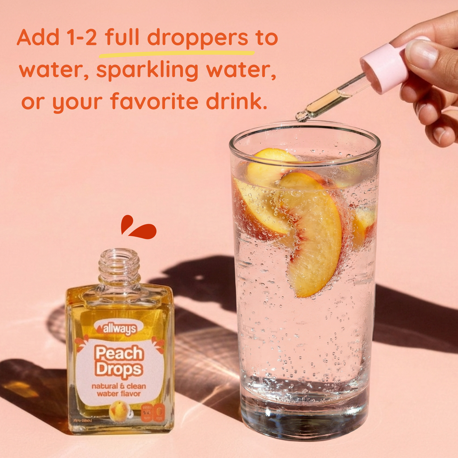 Peach Drops bottle with a glass of water and peach slices on a pink background