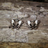 Hand-painted wooden pelvis anatomy dangle earrings featuring an anatomical pelvis design with lightweight construction and hypoallergenic .925 sterling silver hooks, perfect for doctors, nurses, physical therapists, chiropractors, medical students, and healthcare professionals.