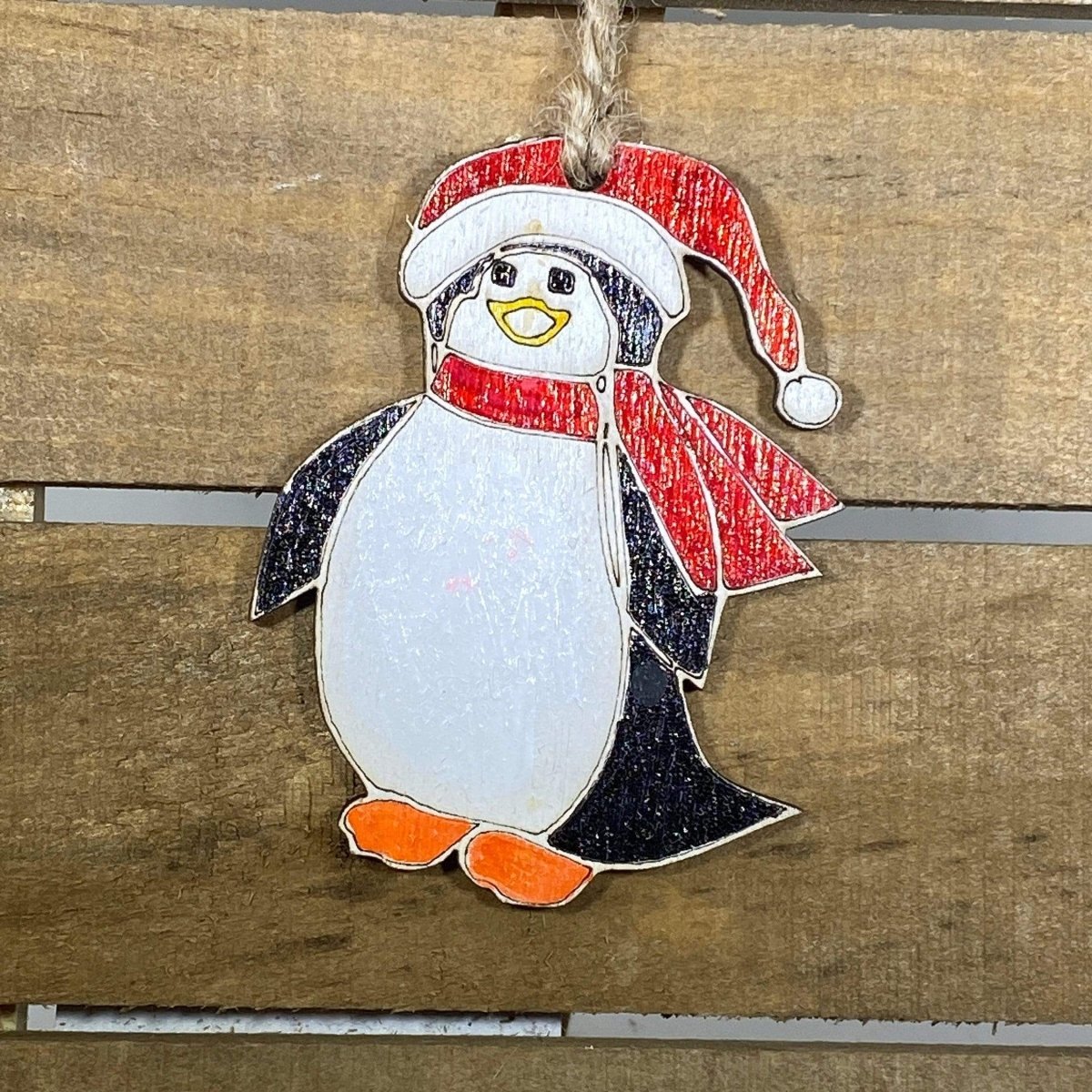 Hand-painted wooden penguin Christmas ornament with cute winter holiday design and lightweight festive decor, adorable tree decoration gift for penguin lovers and holiday decorating 