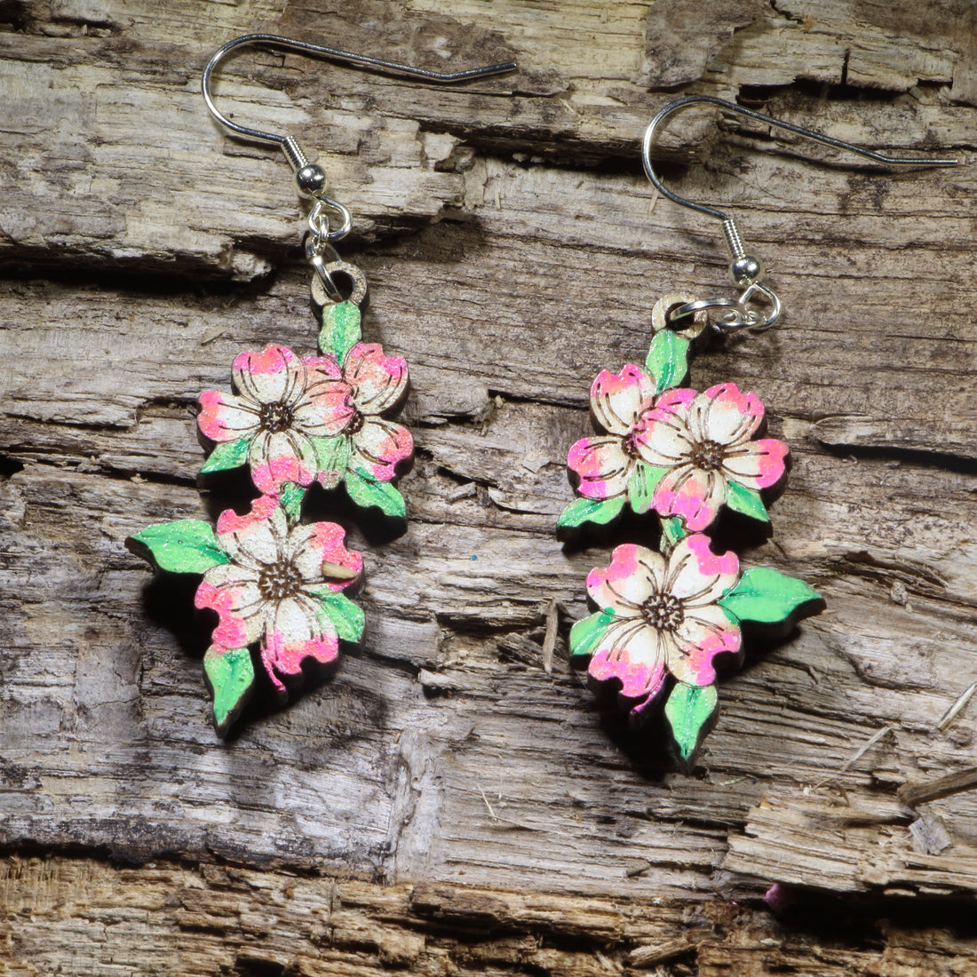 Hand-painted pink dogwood blossom wooden dangle earrings on hypoallergenic .925 sterling silver hooks. Lightweight floral nature jewelry for flower lovers, gardeners, spring fashion, and botanical enthusiasts.