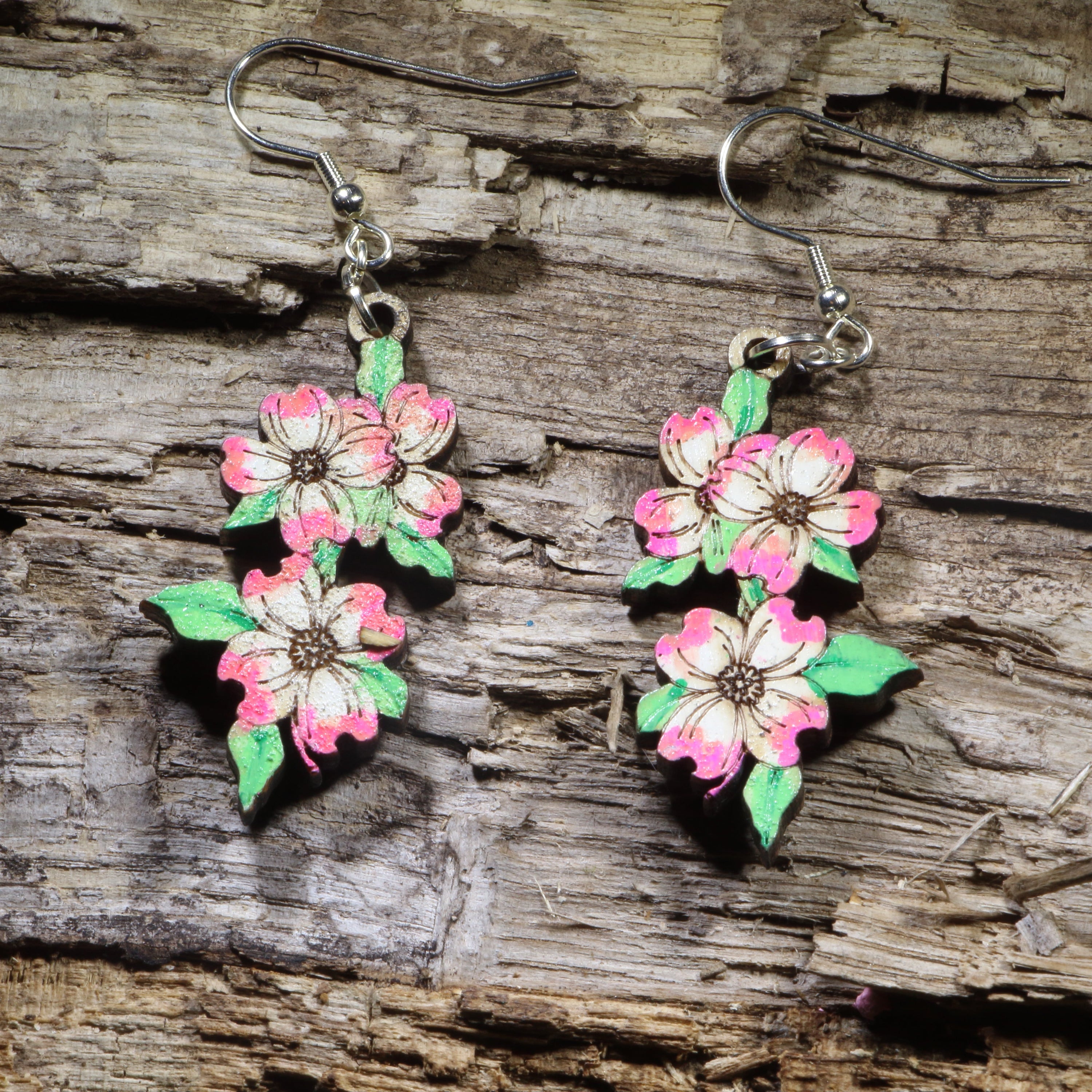 Hand-painted pink dogwood blossom wooden dangle earrings on hypoallergenic .925 sterling silver hooks. Lightweight floral nature jewelry for flower lovers, gardeners, spring fashion, and botanical enthusiasts.