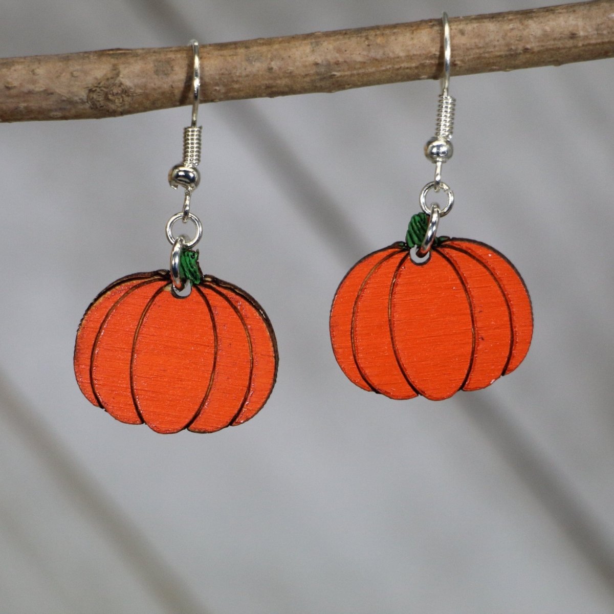 Hand-painted wooden pumpkin dangle earrings with classic fall autumn design and hypoallergenic sterling silver hooks, lightweight pumpkin statement jewelry earrings for seasonal harvest style 