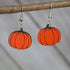 Hand-painted wooden pumpkin dangle earrings with classic fall autumn design and hypoallergenic sterling silver hooks, lightweight pumpkin statement jewelry earrings for seasonal harvest style 